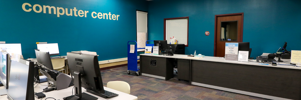 Computer Center showing desktop computers for patron use and department desk