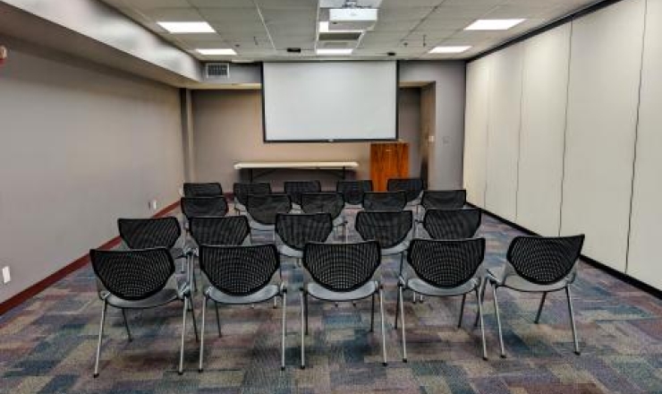 Meeting Room A - Back of room with screen down and chairs in rows